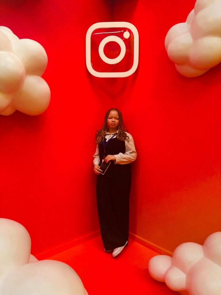 Christabel Obi-Nwosu, MTSU Student, in front of Instagram logo